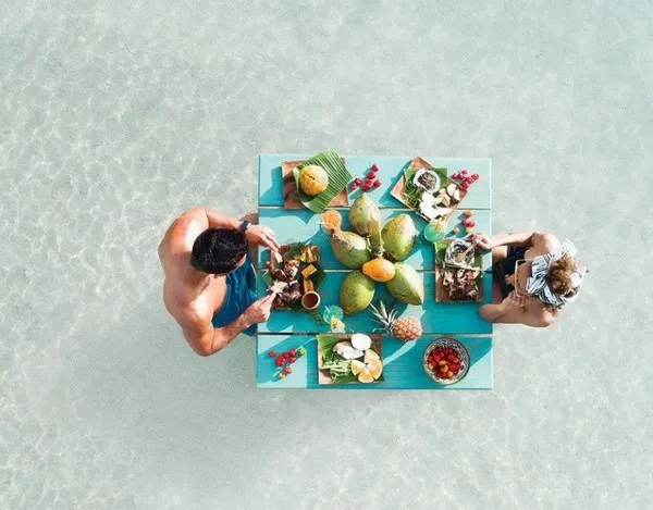 Exotic breakfast in water for a couple 